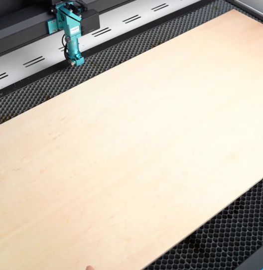 put the wood on the laser bed.webp