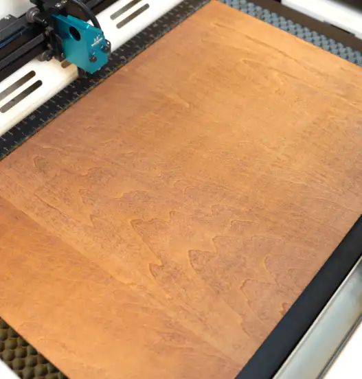 put plywood on the laser bed.webp