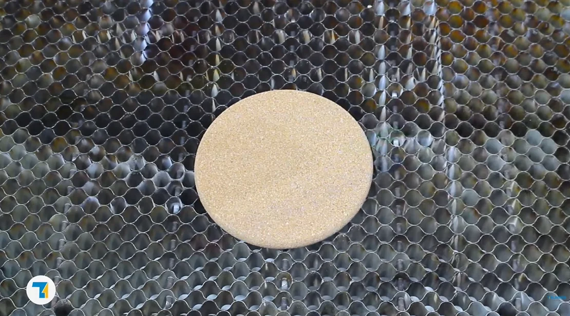 put the cork coaster on the laser bed.webp